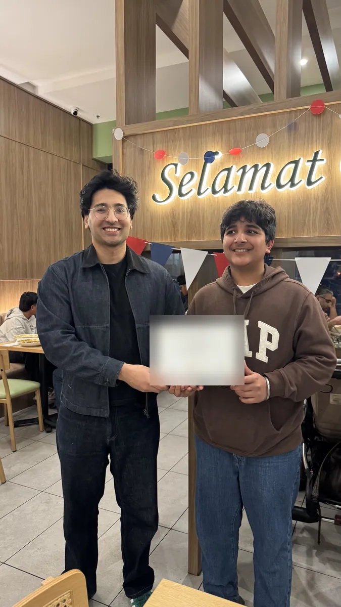 An Aspire student receiving a certificate at the 2026 Selective Entry dinner