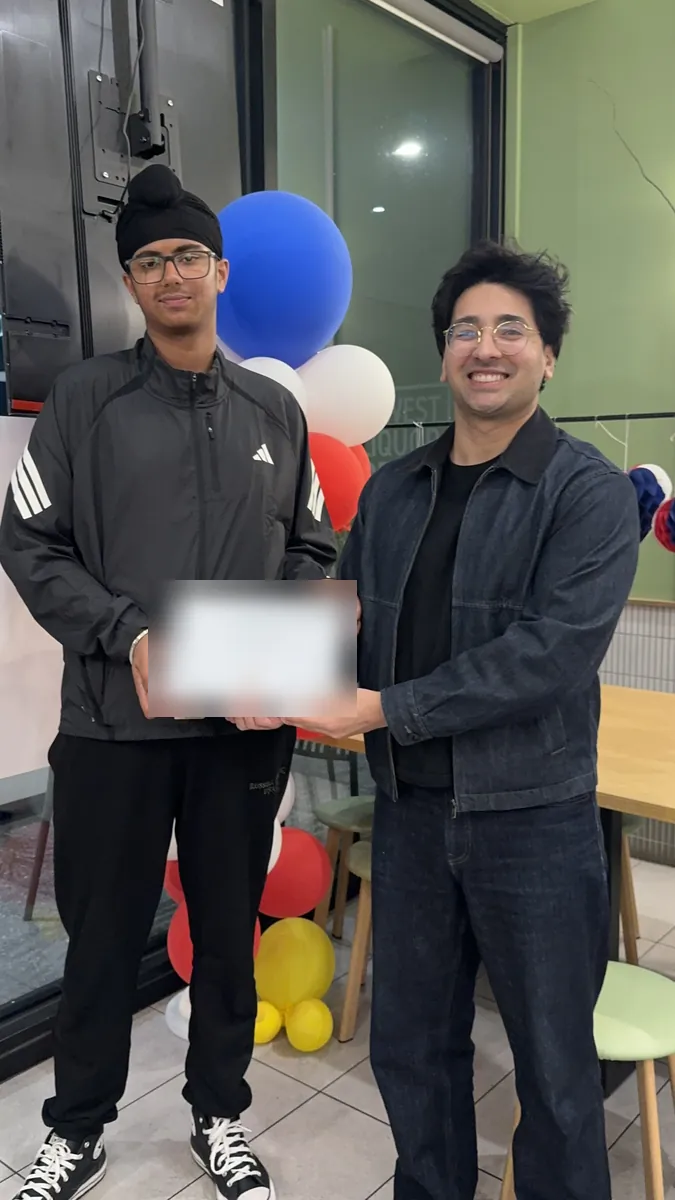 An Aspire student receiving a certificate at the 2026 Selective Entry dinner