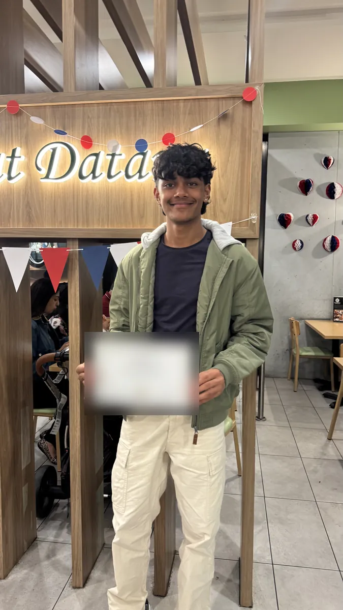 An Aspire student holding a certificate at the 2026 Selective Entry dinner